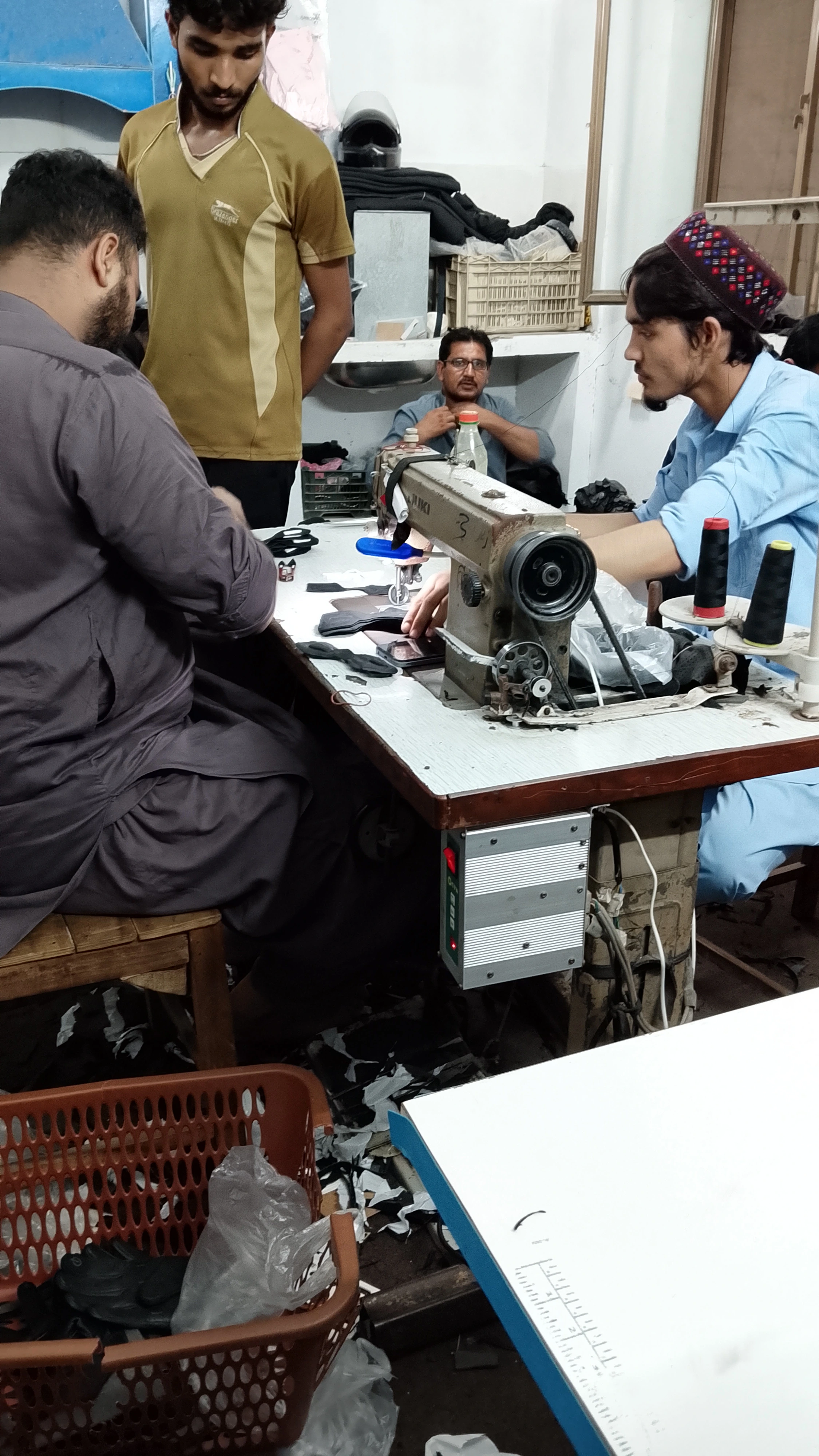 Team reviewing product quality at the workstation